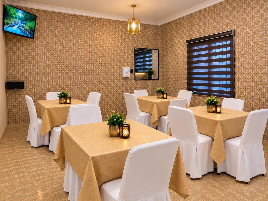 Elegant restaurant tables with white chairs and candle lanterns