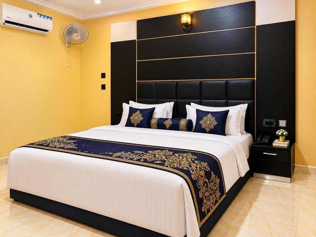 Royal Room bed with navy and gold runner